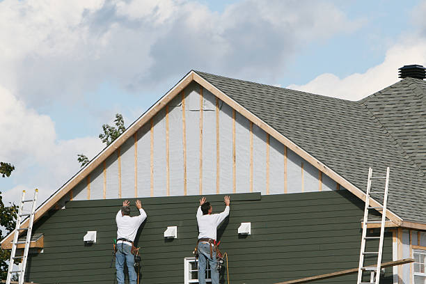 Professional Siding Installation technician working in Winchester, MA